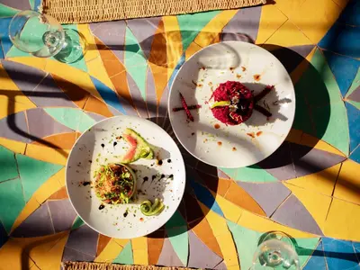 two plates of food sitting on a table at Maison Daouia in Marrakech