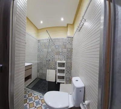 a bathroom with a toilet and a sink at FIFI maison in Ouarzazate