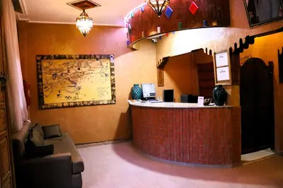 a lobby of a restaurant with a counter and a bar at Riad ait Ben Haddou in Aït Ben Haddou