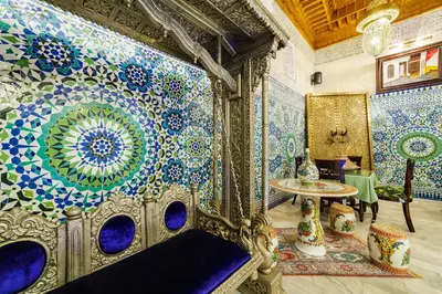 a room with blue and white tiles on the wall at Riad Rcif Alif Suite & SPA in Fès