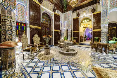 a lobby of a building with mosaics on the floors at Riad Rcif Alif Suite & SPA in Fès