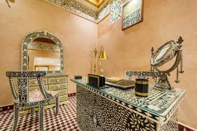 a dressing room with a mirror and a dressing table at Riad Rcif Alif Suite & SPA in Fès