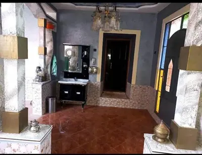 a large living room with a sink and a mirror at Assounfou in Ouarzazate
