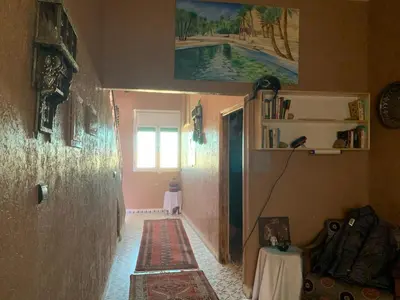 a hallway of a house with a table and a window at Birgits Bed & Bistro, Garage für Biker kostenlos in Madkhal Meski