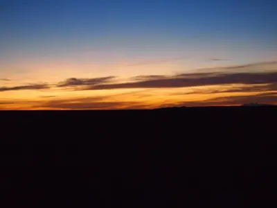 an image of a sunset in the desert at Birgits Bed & Bistro, Garage für Biker kostenlos in Madkhal Meski