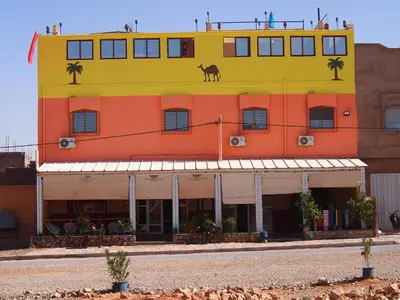 a building with a horse on the top of it at Birgits Bed & Bistro, Garage für Biker kostenlos in Madkhal Meski