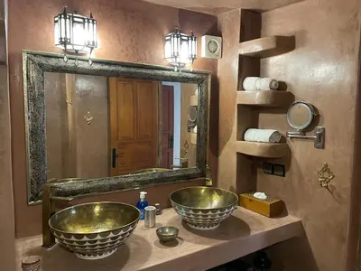 a bathroom with two sinks and a large mirror at DAR SEFFAH au cœur de la Médina in Fès