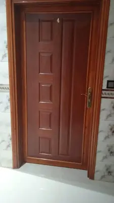 a wooden door in a room with at Ozoud high standing appartment in Ouzoud