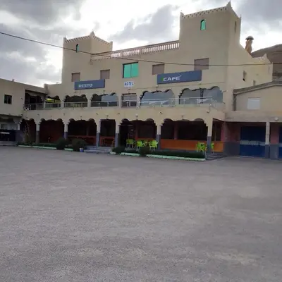 a large building with a parking lot in front of it at ESPACE INOV IMILCHIL in Imilchil