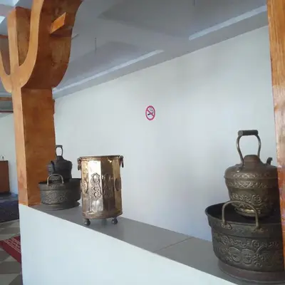 a group of vases sitting on a shelf at ESPACE INOV IMILCHIL in Imilchil