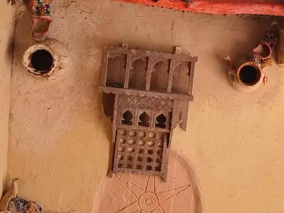 a bird feeder on the side of a building at Authentique Berbère in Agoulzi