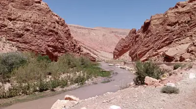 a river in the middle of a canyon at Authentique Berbère in Agoulzi