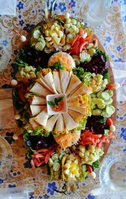 a pile of different types of food on a table at GITE BOUKHALFA in Missour