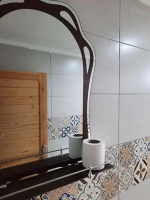 a bathroom with a mirror and two toilets in it at GITE BOUKHALFA in Missour