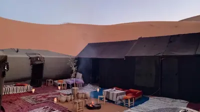 a large tent with tables and chairs in it at Gambi Camp in Hassilabied