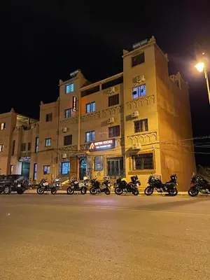 a group of motorcycles parked in front of a building at Hotel Rayyan l 'Escale in Ouarzazate