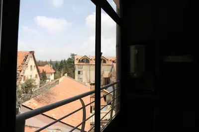 a view of a city from a window at APPARTEMENT AMIRA iFRANE in Ifrane