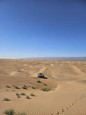a truck parked in the middle of a desert at BiVOUAC CÔTE-IRIKI in Foum Zguid
