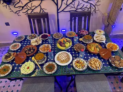 a table topped with lots of plates of food at Riad Diamant De Fes in Fès