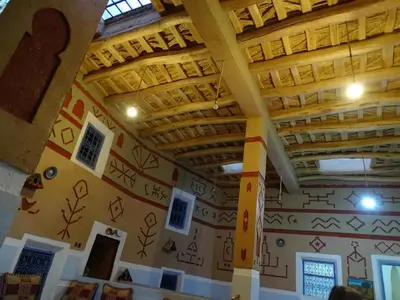 a room with a wall with drawings on it at Riad DAR outebba in Zaouïet Sidi Daoud