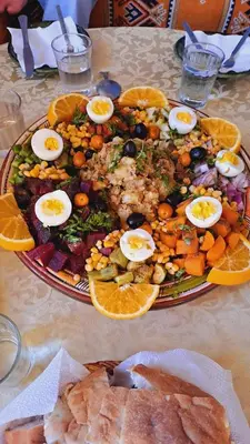 a plate of food with eggs on a table at LA PETITE MAISON DU LAC IRIKI in Foum Zguid