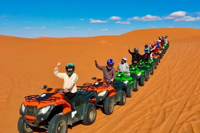 a group of people on atvs in the desert at Stargazing Merzouga Camp in Merzouga