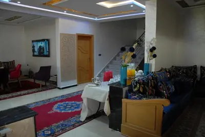 a living room with a couch and a table at Moonrise Villa VIP Midelt in Midelt