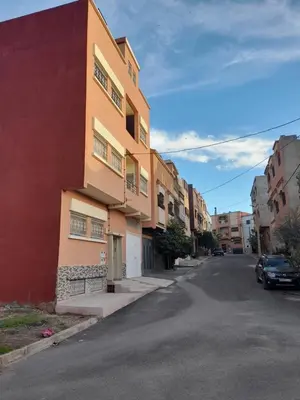 a building on the side of a street at Appartement meublé ennasr49 in Khenifra