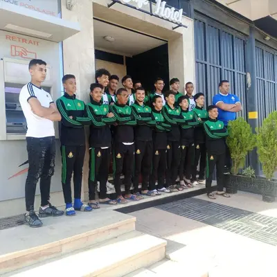 a group of people standing in front of a building at Hotel La coline in Beni Mellal