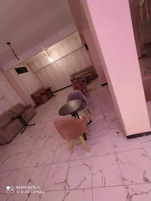an empty room with a table and chairs in it at Hotel La coline in Beni Mellal