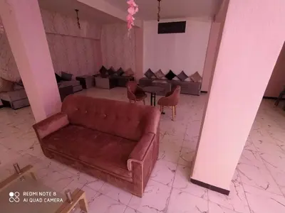 a rendering of a living room with a couch and chairs at Hotel La coline in Beni Mellal