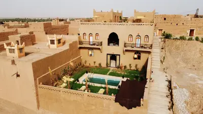 an aerial view of a building with a swimming pool at Riad Dar Tiziri in Zagora