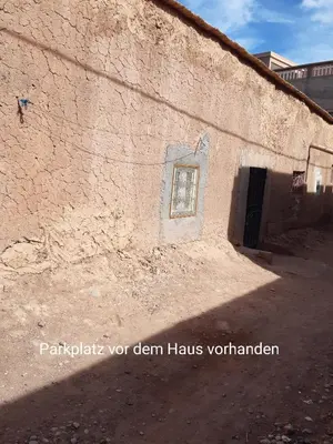 a building with a window on the side of it at Dar Sahara Ouarzazate in Ouarzazate