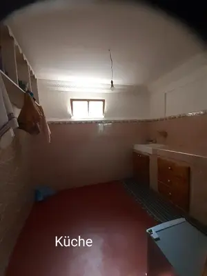 a small room with a sink and a window at Dar Sahara Ouarzazate in Ouarzazate