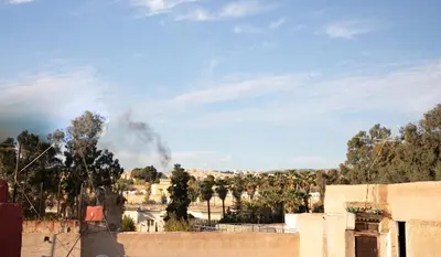 a view of a fire with smoke in the distance at Riad bel kaid fes in Fès
