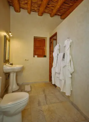 a bathroom with a toilet and a sink at Dar Imiri in Ourika