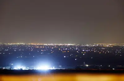 a view of a city at night with lights at Dar Imiri in Ourika