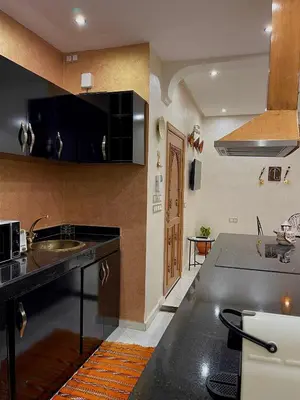 a kitchen with a sink and a counter top at Stay In Fez in Fès