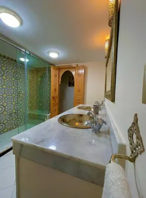 a bathroom with a sink and a shower at Stay In Fez in Fès