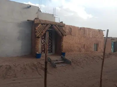 an entrance to a building in the desert at Bivouac beauté du désert in Mhamid