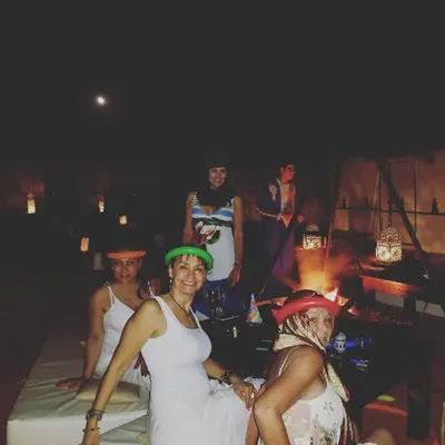 a group of women posing for a picture at a party at Erg Chebbi Desert Luxury Camp in Merzouga