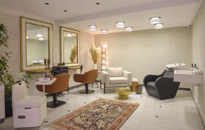 a salon with a waiting room with chairs and a mirror at Dar Lys Luxury Riad & Spa in Fès