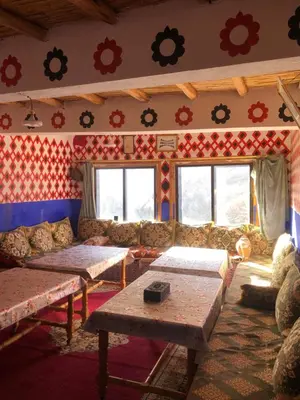 a living room with a couch and a table at Gite La belle vue Timichi in Timichi