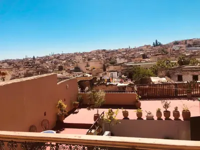a view of a city from the roof of a building at famille fahym in Fès