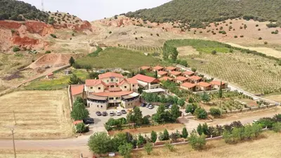 an aerial view of a house in a mountain at Auberge Tourtite in Ifrane