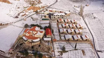 an aerial view of a village in the snow at Auberge Tourtite in Ifrane