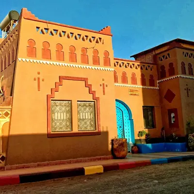 a building with a window on the side of it at Riad Hassi Labied Merzouga in Merzouga