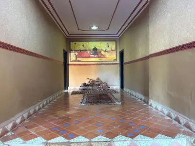 a room with a tile floor and a painting on the wall at Hotel Zagour - Luxury hotel in Zagora in Zagora
