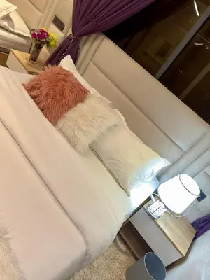 a white couch with a furry pillow at la vue panoramique in Marrakech