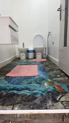 a bathroom with a painting on the floor at la vue panoramique in Marrakech